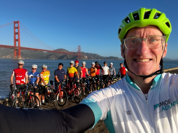 More Adventure leader Marcus Taylor with a group of riders at the Golden Gate Bridge