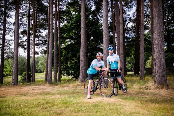Two leaders with their bikes in a forest