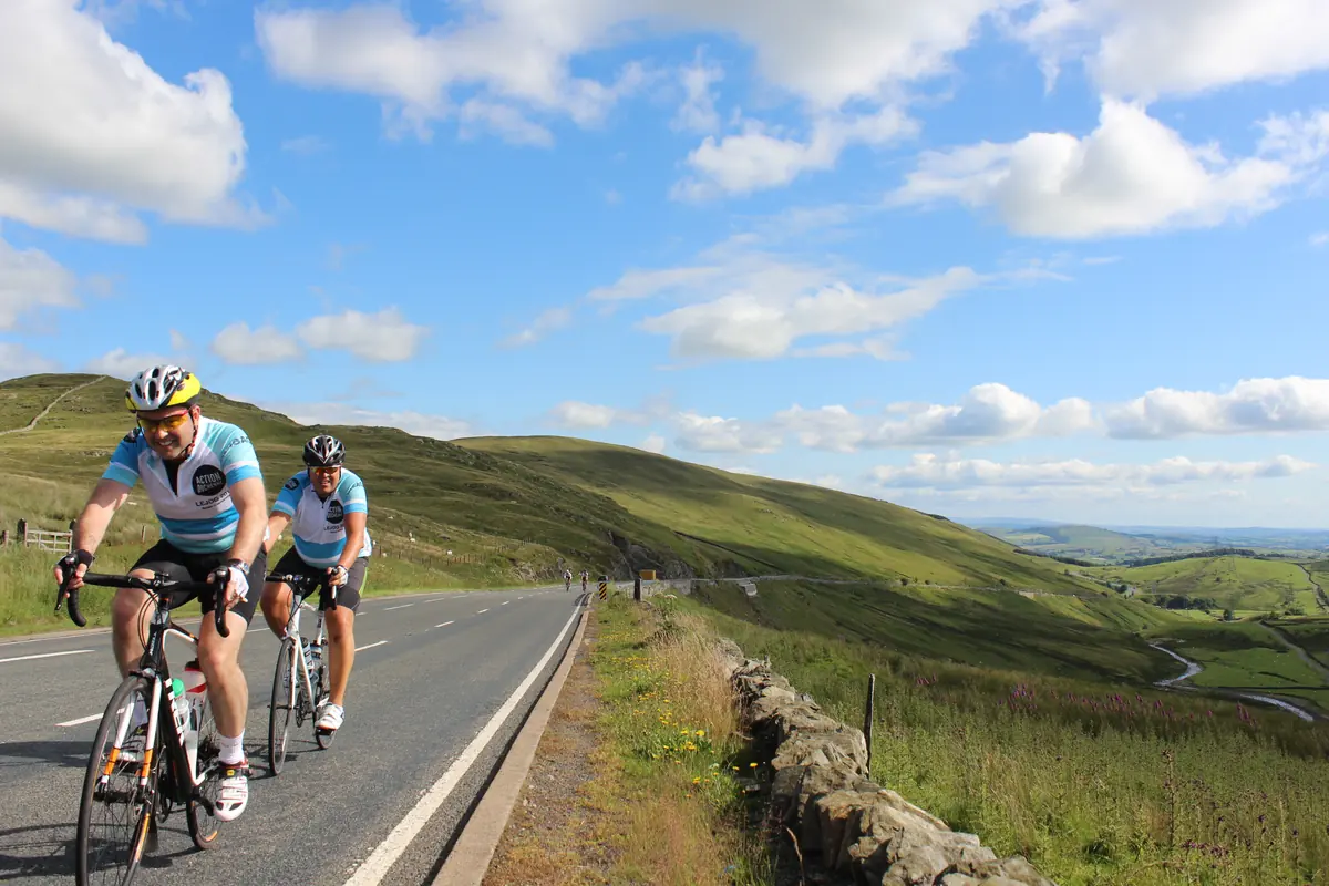 Action Duchenne charity riders climbing a mountain road in the Scottish Highlands