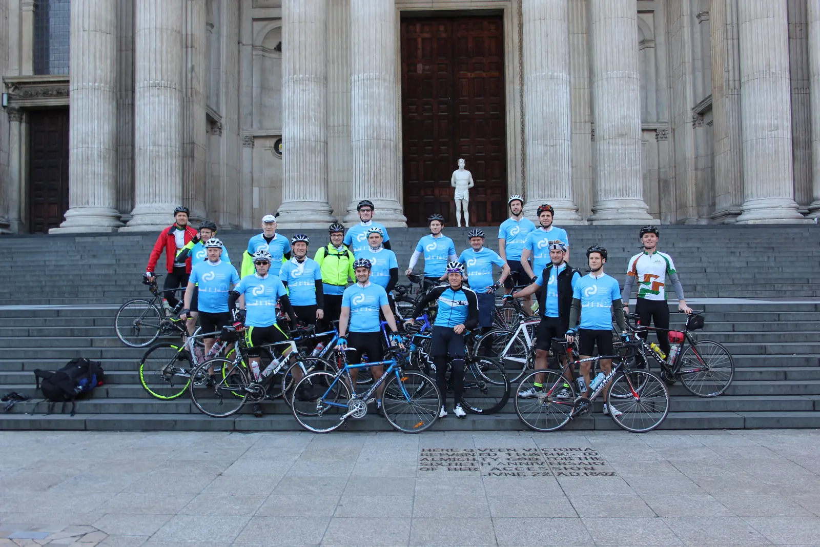 A CCLG charity cycling team on the steps of St Paul's Cathedral at the start of their London to Cologne ride