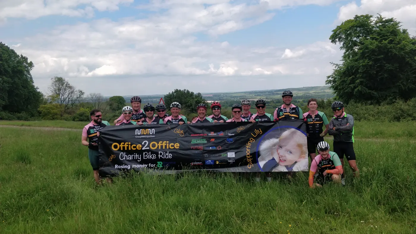 Reverse Rett charity riders with their Office2Office banner on a Warrington to London bike ride
