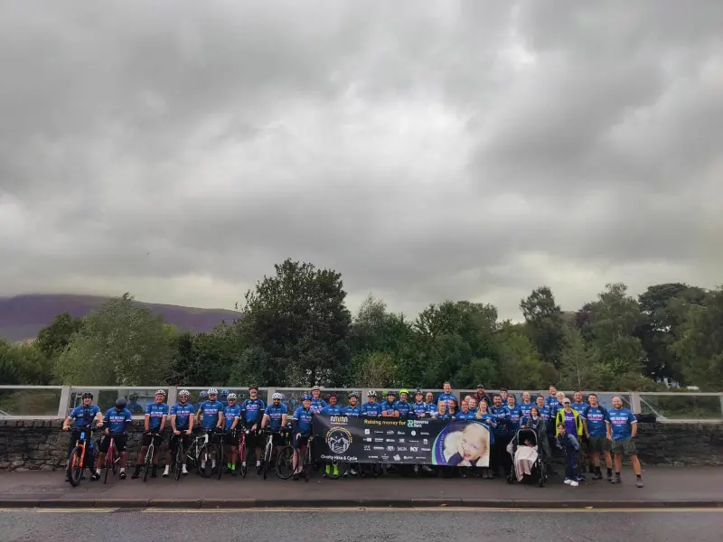 The whole team lined up with their bikes in the Lake District