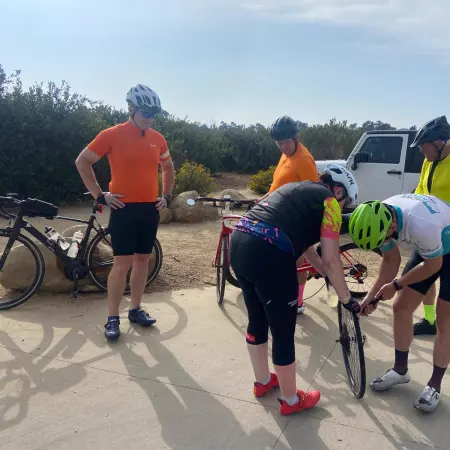 More Adventure staff fixing a rider's bike at the roadside