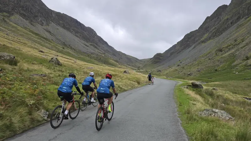 Riders climbing Honister Pass