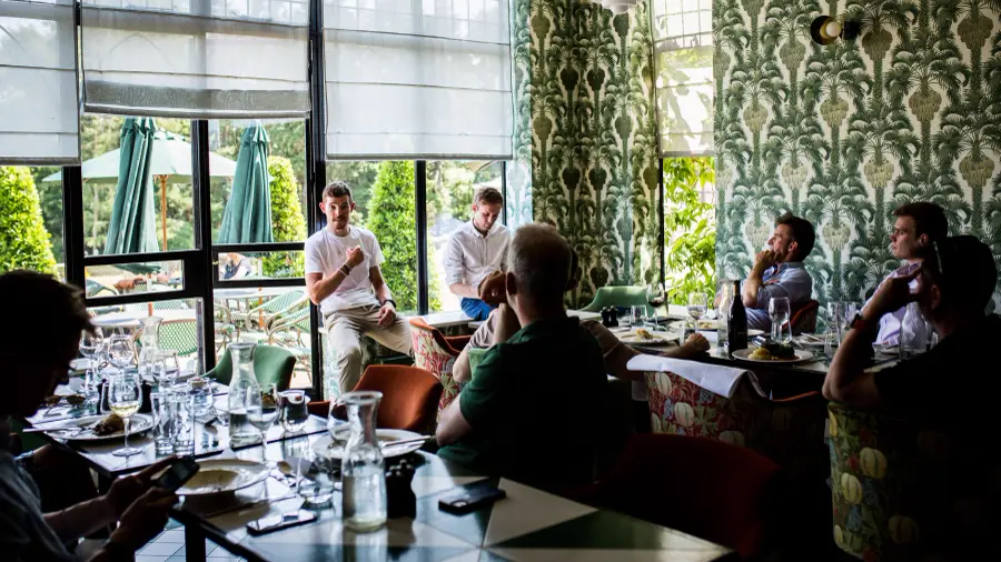 A corporate group at dinner in a restaurant after their challenge