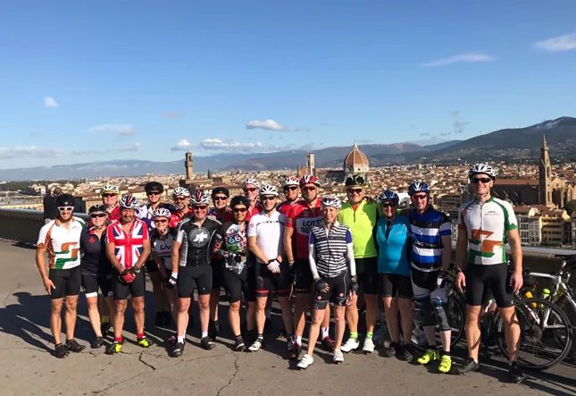 A More Adventure group with their bikes above the Florence skyline