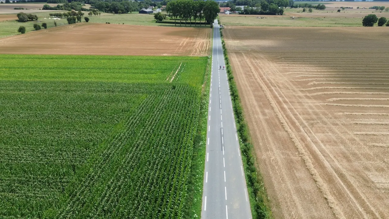 A straight road through French farmland seen from above