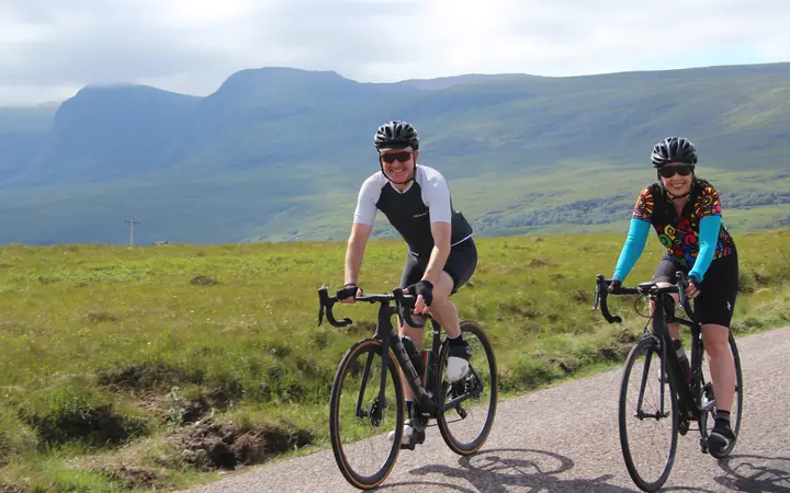 Two cyclists riding the North Coast 500 in the Scottish Highlands